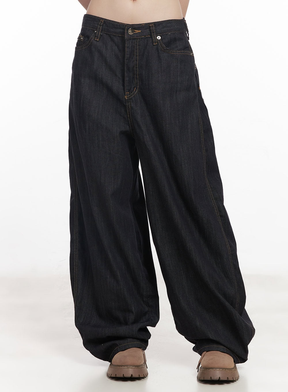 LEWKIN Jessie Stitched Wide-Leg Jeans CY520 in dark blue, front view on model, baggy cotton denim with contrast topstitching, low rise, pooling hem, paired with brown chunky loafers.