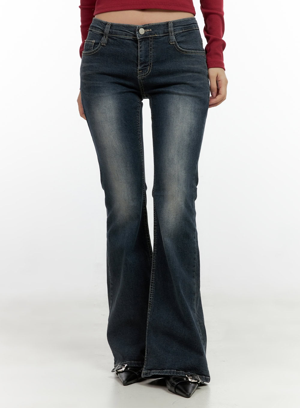 LEWKIN Ingrid Low-Rise Washed Flared Hip Pad Denim Jeans CN404 in dark blue, front waist-down shot on model, slim-fit bootcut silhouette, washed denim with fading, paired with black buckle heels.