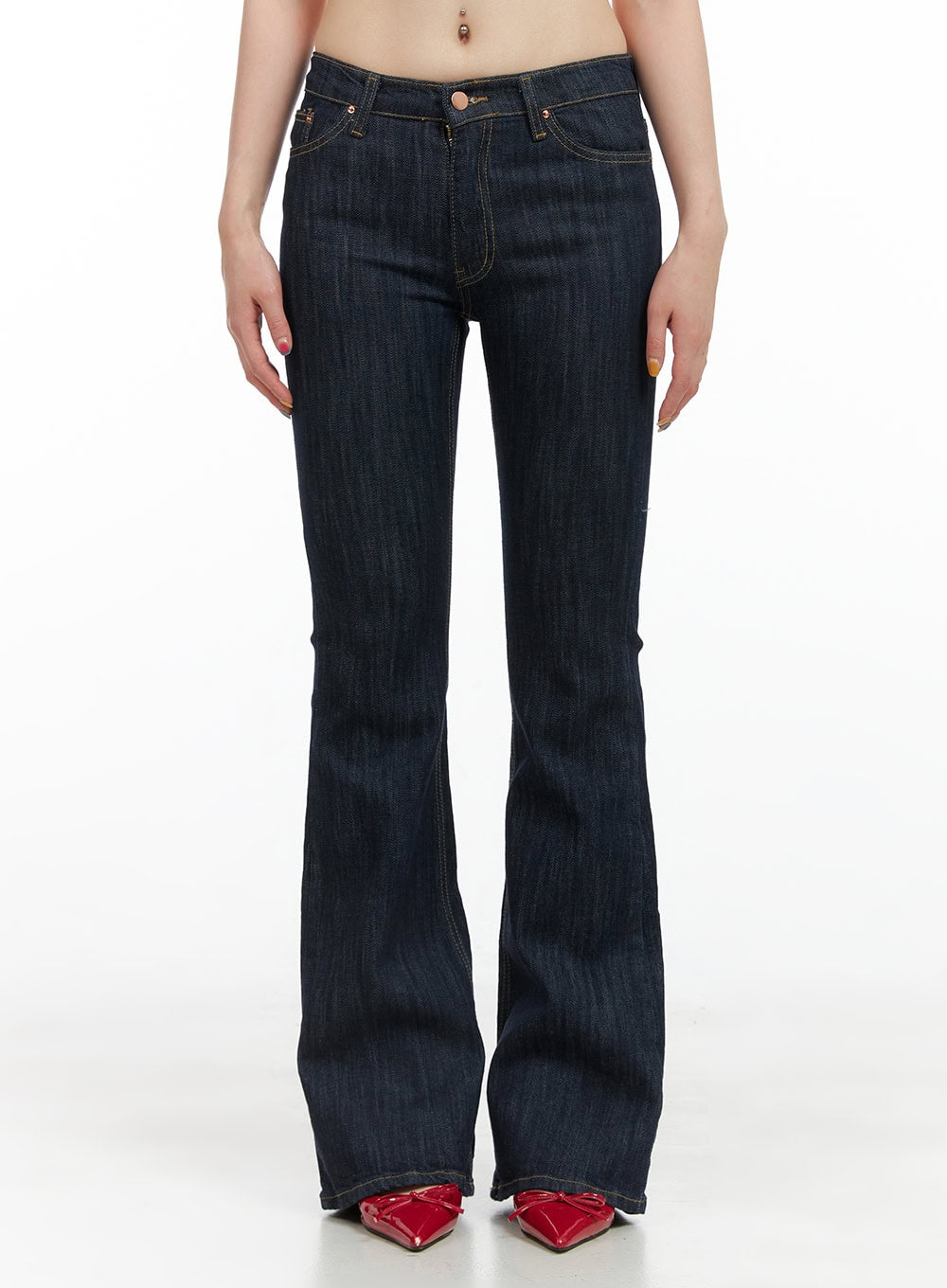 LEWKIN Lila Slim Fit Bootcut Jeans CG409 in dark blue, front crop shot on model, slim-fit low-rise denim with bootcut flare hem and contrast stitching, styled with red heels.