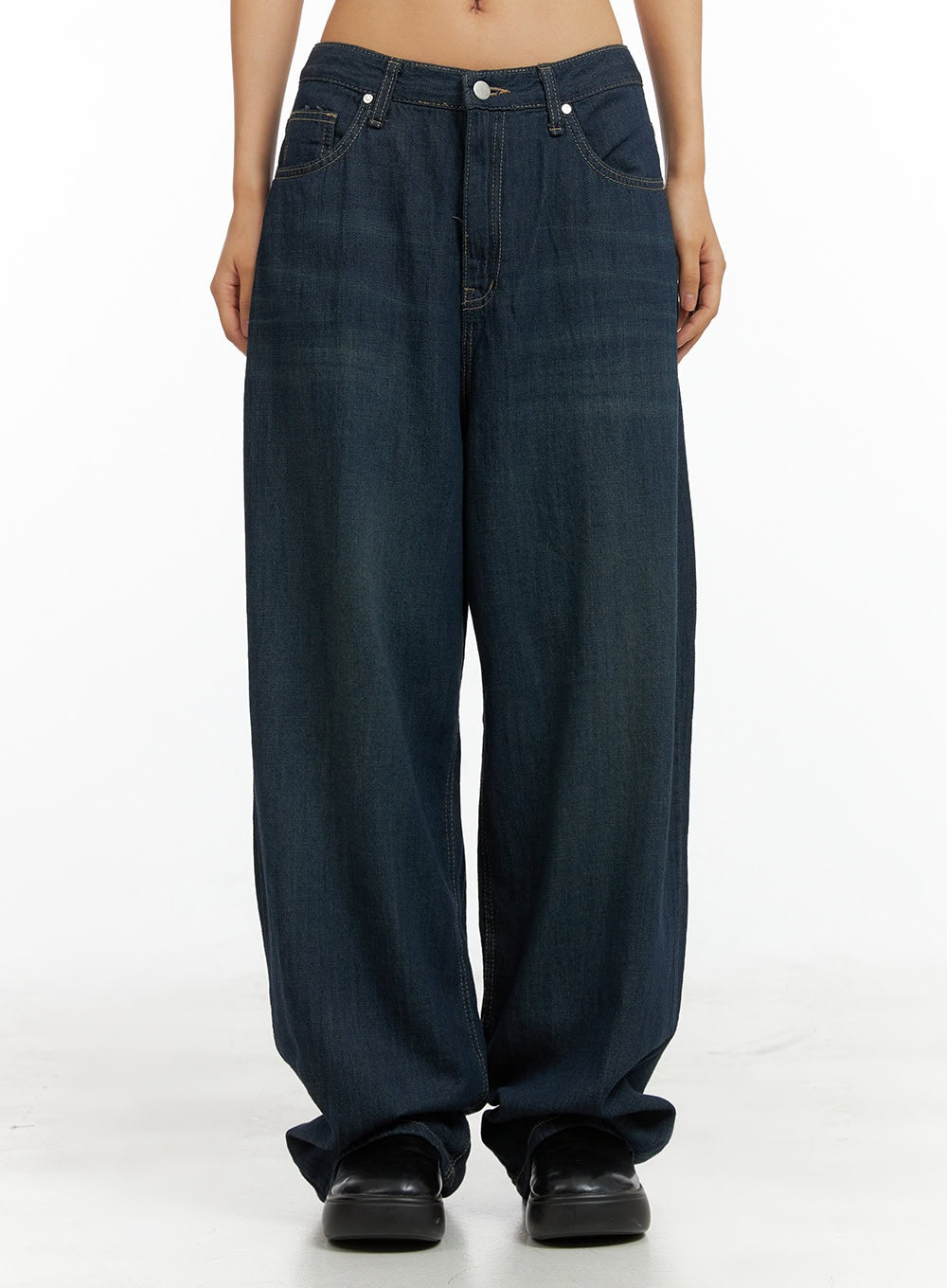 LEWKIN Dark Wash Wide Jeans CU305 in dark blue, front crop view on model, low-rise waist with button closure, oversized wide leg cotton denim, paired with black chunky loafers.
