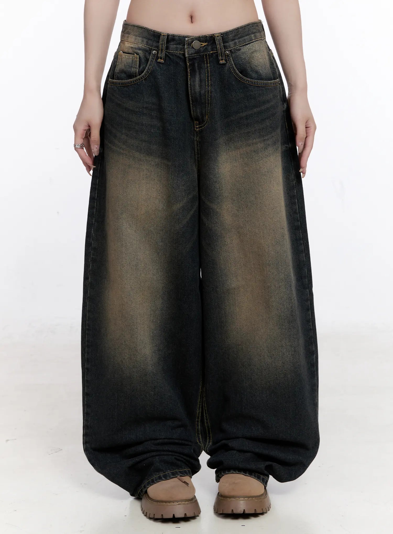 LEWKIN Sylvia Vintage Washed Baggy Jeans CO501 in dark blue, front view on model, oversize cotton baggy fit with amber wash fade, five-pocket styling, pooling hem, paired with chunky brown loafers.