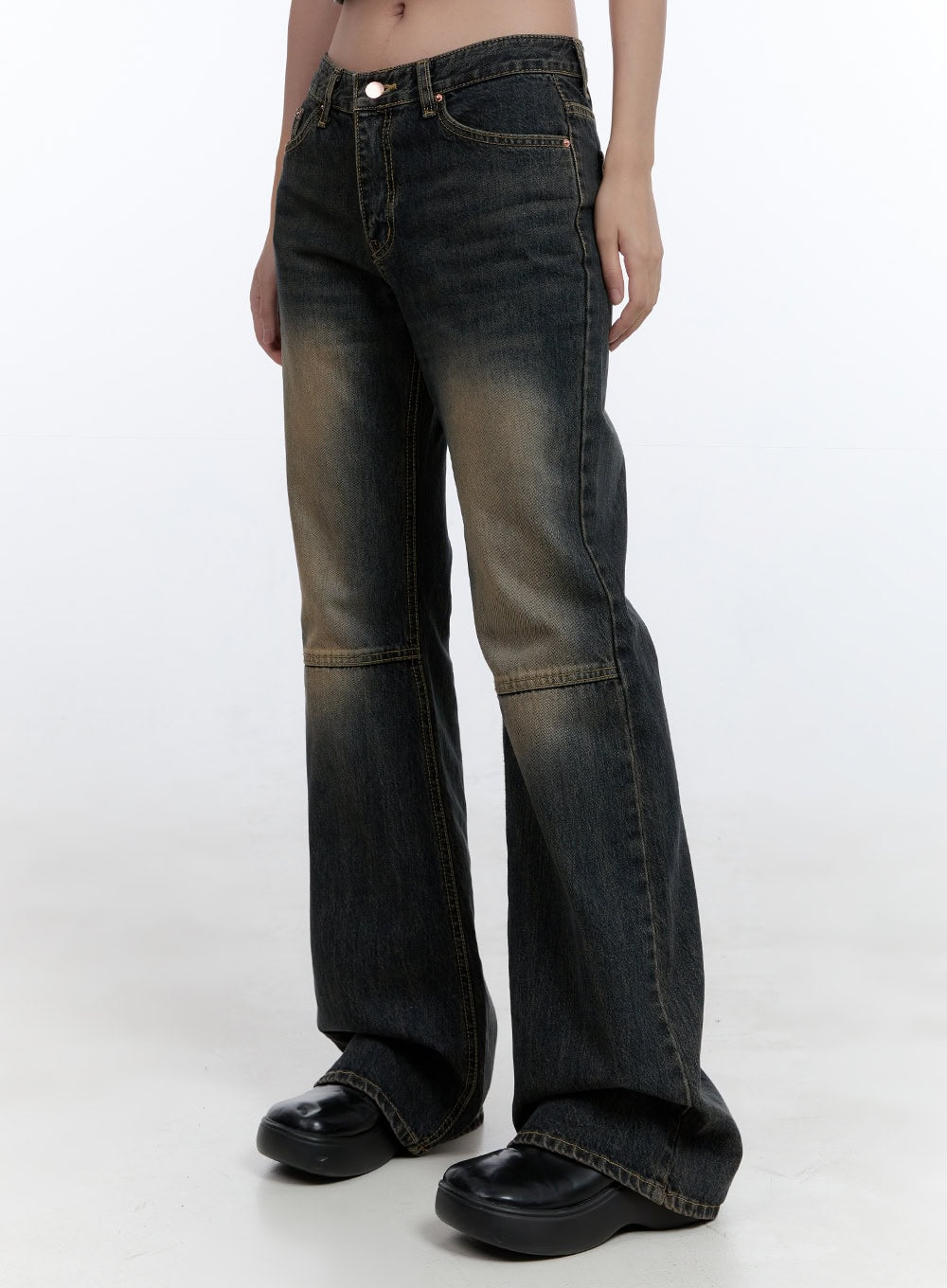 LEWKIN Kira Stitched Detail Bootcut Jeans CG414 in dark blue, front three-quarter crop view on model, low-waist washed denim with amber fading, horizontal knee stitch seam, slim bootcut leg, styled with black platform loafers.