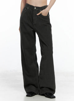 LEWKIN Corduroy Wide Pants CN518 in dark gray, front side view on model, cropped shot showing corduroy ribbed texture, mid-rise waist with silver button, wide-leg silhouette, black loafers.