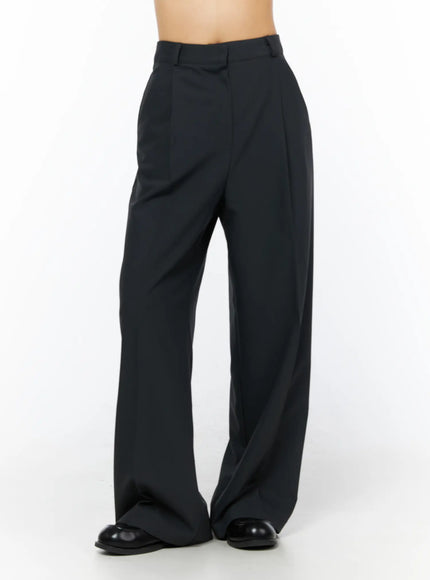 LEWKIN Basic Pintuck Wide Slacks CU522 in dark gray, front-angle view on model, high-waist tailored wide-leg silhouette with pintuck seams, paired with black loafers.