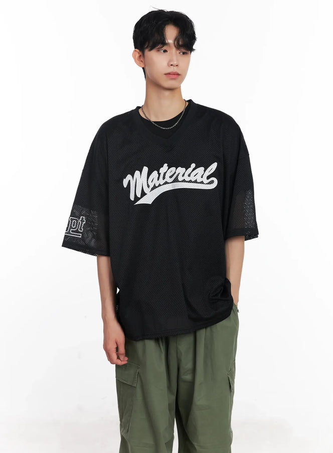 LEWKIN Men's Embroidered Mesh Graphic Tee IU526 in black, front crop view on model, oversized mesh fabric with white script embroidery, paired with olive cargo pants.