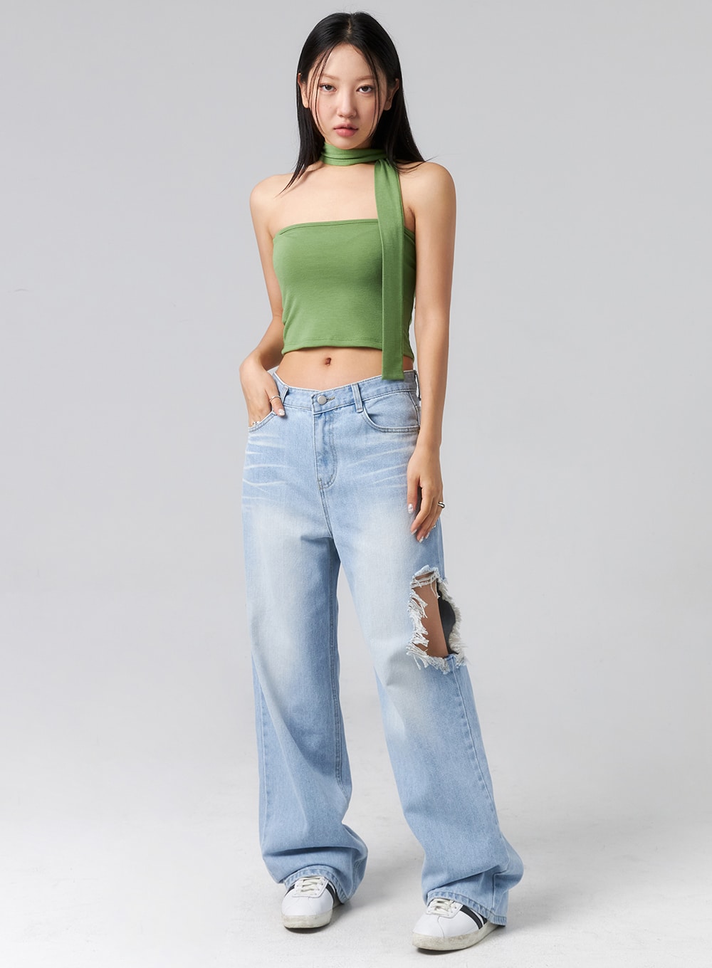 LEWKIN Ripped Side Jeans CL320 in light blue, full-length front view on model, wide-fit cotton denim with large destroyed side rip at thigh, paired with green halter crop top and white sneakers.