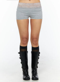 LEWKIN Lace Trim Cotton Micro Shorts CU518 in gray, front waist-down crop on model, slim-fit cotton-spandex micro shorts with floral lace waistband, paired with black buckle knee-high boots.