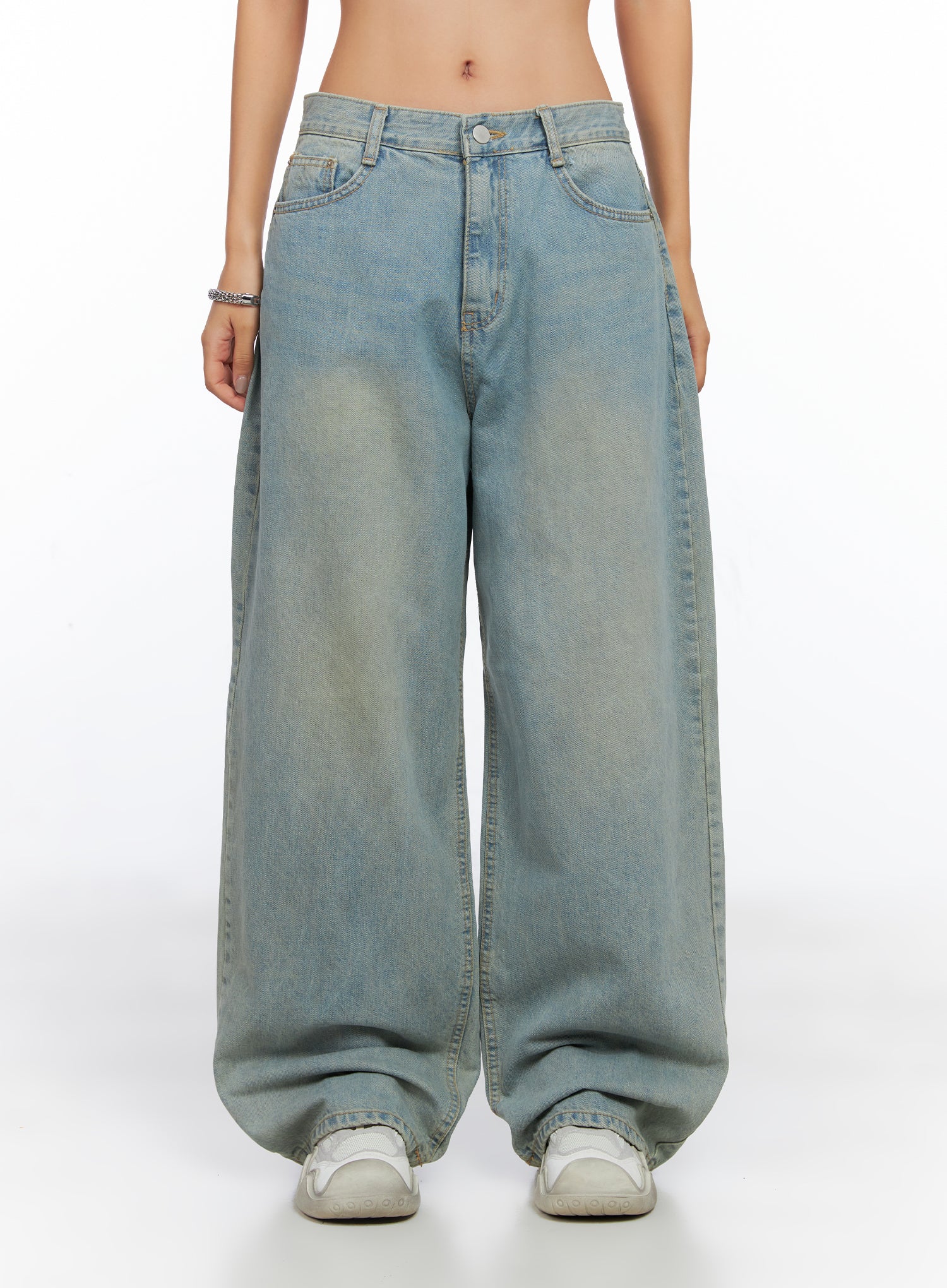 LEWKIN Remi Washed Baggy Jeans CO515 in light blue, front view on model, loose-fit cotton denim with washed finish, wide leg pooling at white sneakers.