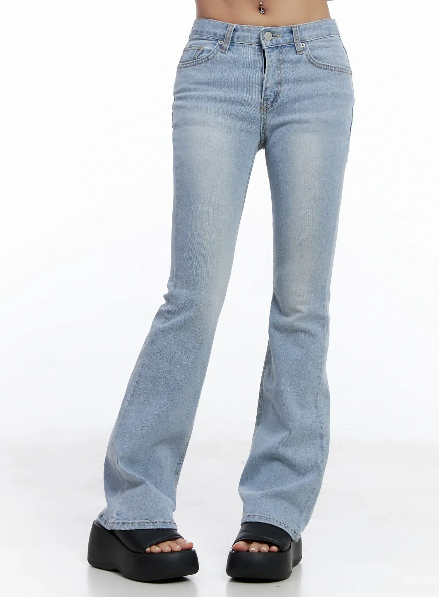 LEWKIN Yeojin Classic Flare Denim Jeans CL510 in light blue, front view on model, washed cotton bootcut with low rise waist, front pockets, paired with black platform sandals.