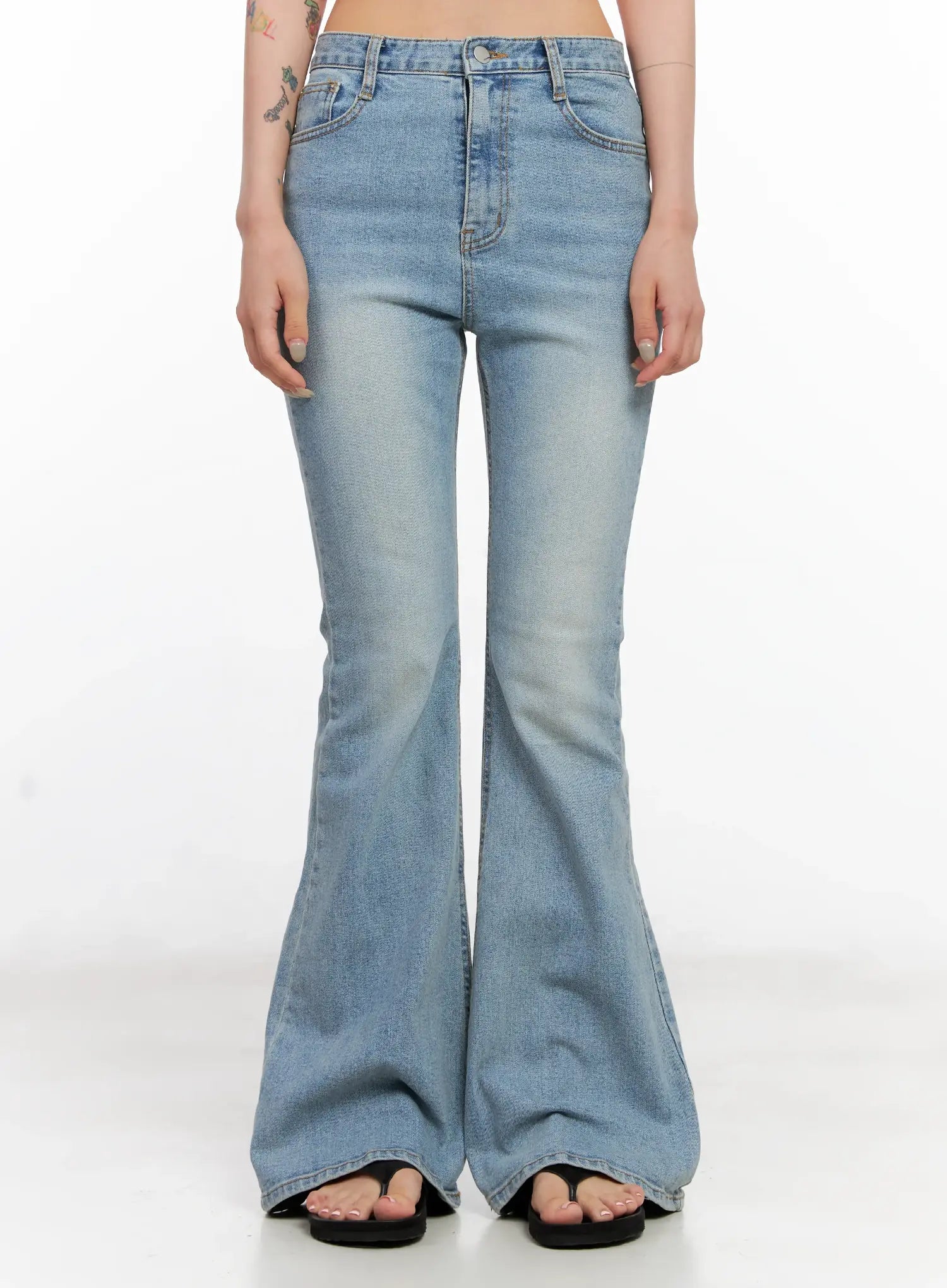 LEWKIN Byeol Washed Flare Denim Jeans CL525 in light blue, front view on model, slim-fit cotton flare with washed finish, front pockets, worn with black sandals.