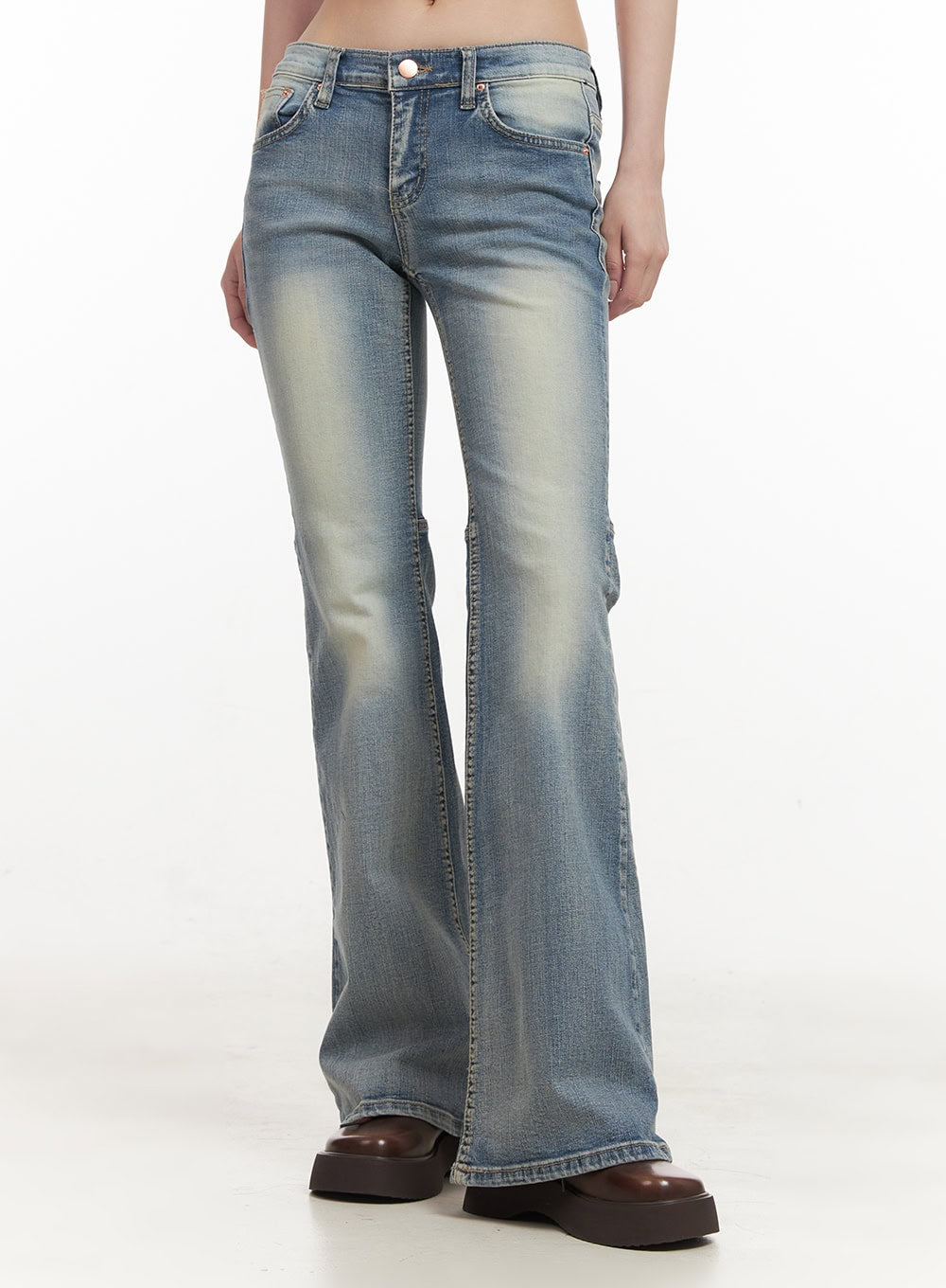 LEWKIN Tracy Washed Bootcut Jeans CF513 in light blue, front waist-to-hem shot on model, slim-fit low-rise denim with washed fading, bootcut flare, worn with brown platform shoes.
