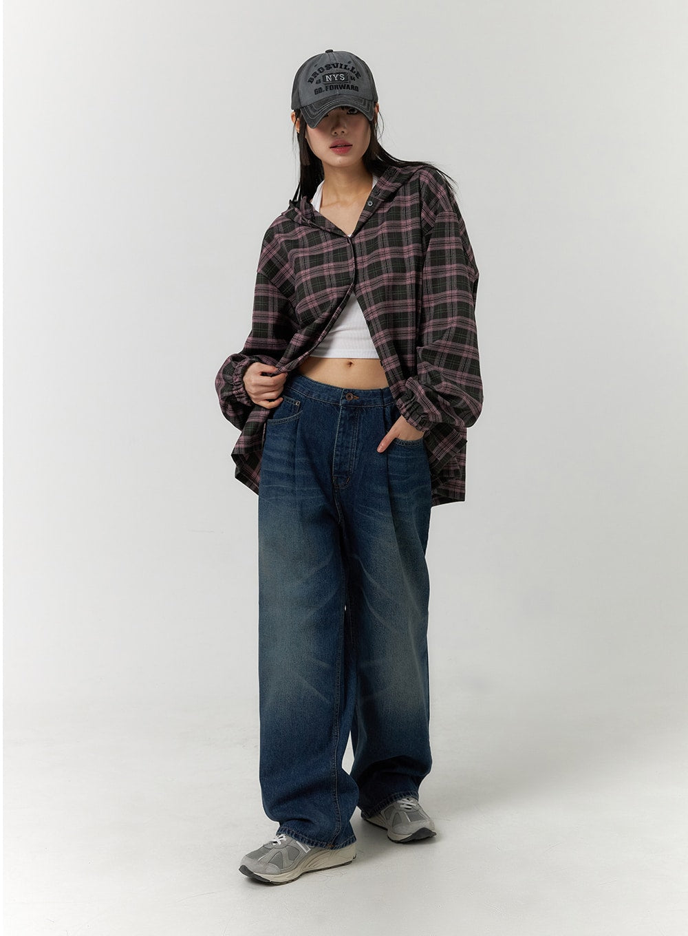 Wide Leg Washed Denim Jeans CF407 in blue, full-length front view on model, relaxed wide-leg silhouette with washed finish, styled with plaid overshirt, white crop top, and cap.