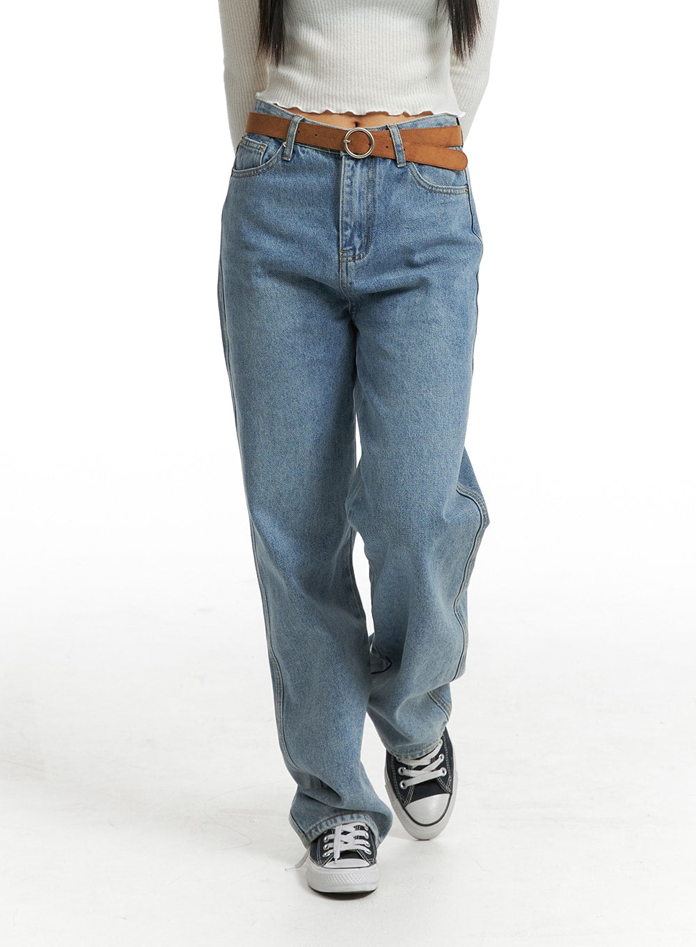 Washed Straight Wide Denim OJ405 in blue, front mid-body close-up on model walking, high-rise waist with brown ring-buckle belt, straight wide leg, sneakers.