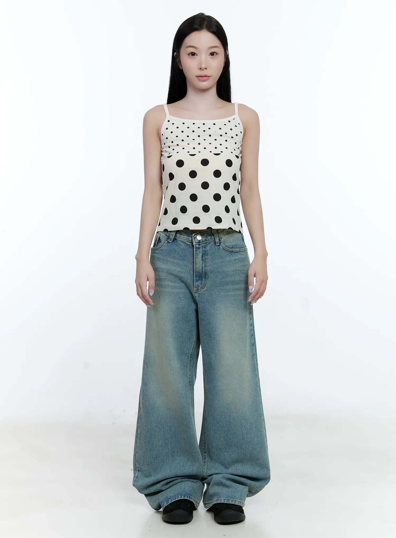 Haeun Wide-Leg Denim Jeans CG501 in blue, full front view on model, long washed denim wide-leg fit, styled with a white polka-dot spaghetti-strap crop top and black shoes.