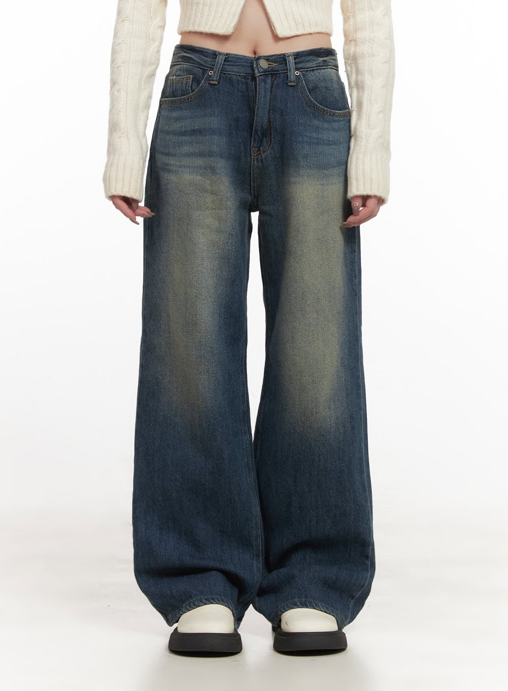 LEWKIN Audrey Washed Wide-Leg Jeans CJ516 in dark blue, front close-up on model, washed cotton denim with yellow-tinted fading, wide-leg silhouette, paired with cream cable-knit crop top.