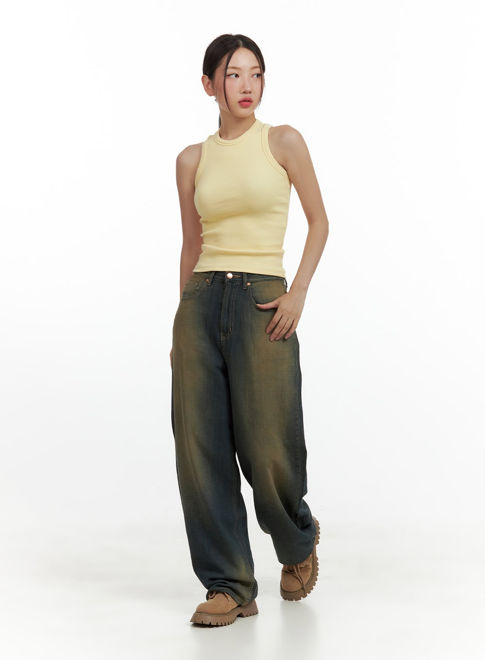 Vintage Washed Denim Baggy Pants CU420 in dark yellow, full-body front view on model, wide-leg silhouette with vintage wash, paired with yellow ribbed tank and brown boots.