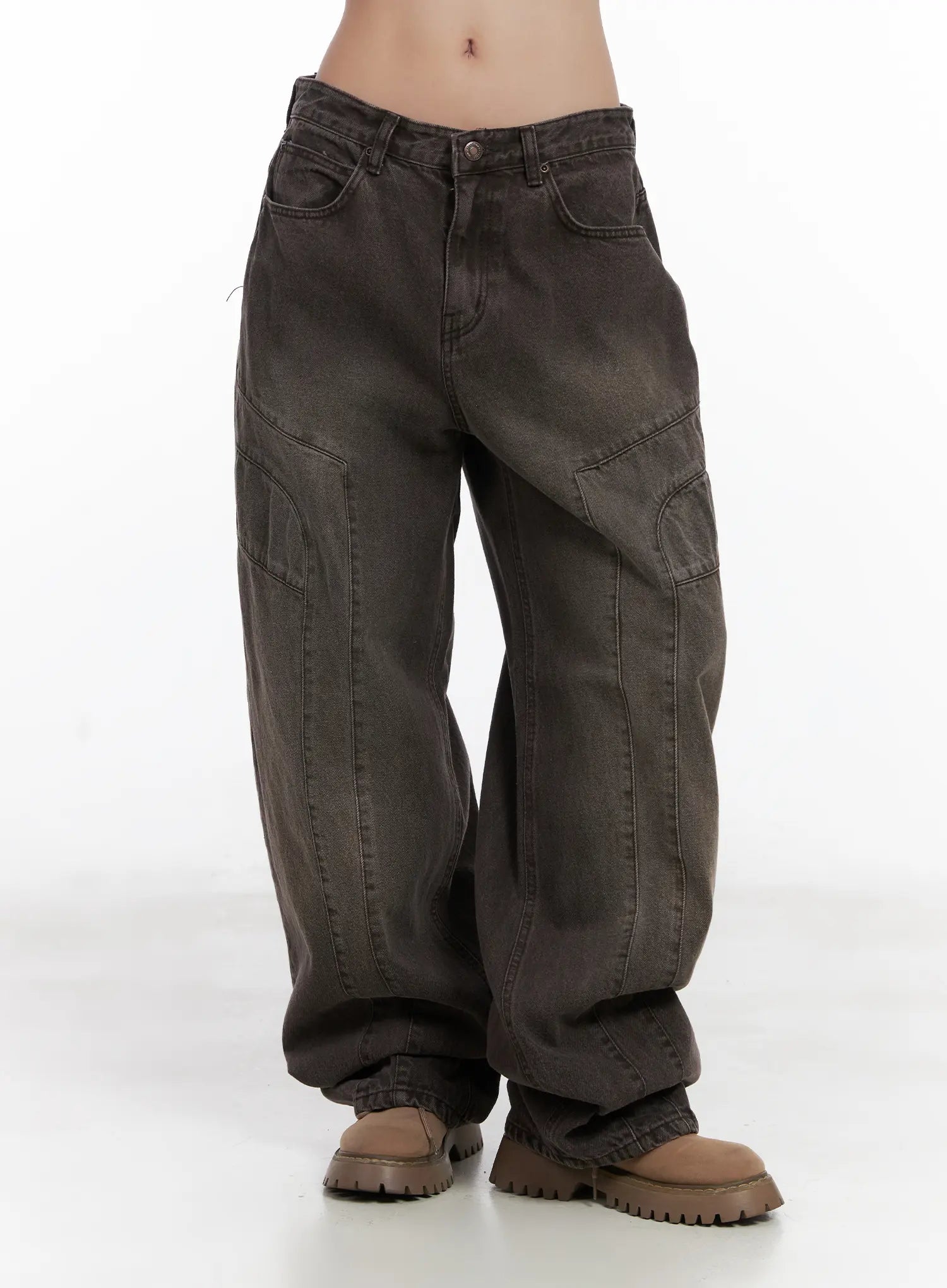 Elia Washed Baggy Jeans CN528 in dark brown, front waist-to-hem product shot, low-rise wide leg with curved seam detailing, large cargo pocket, and pooling hem over tan boots.