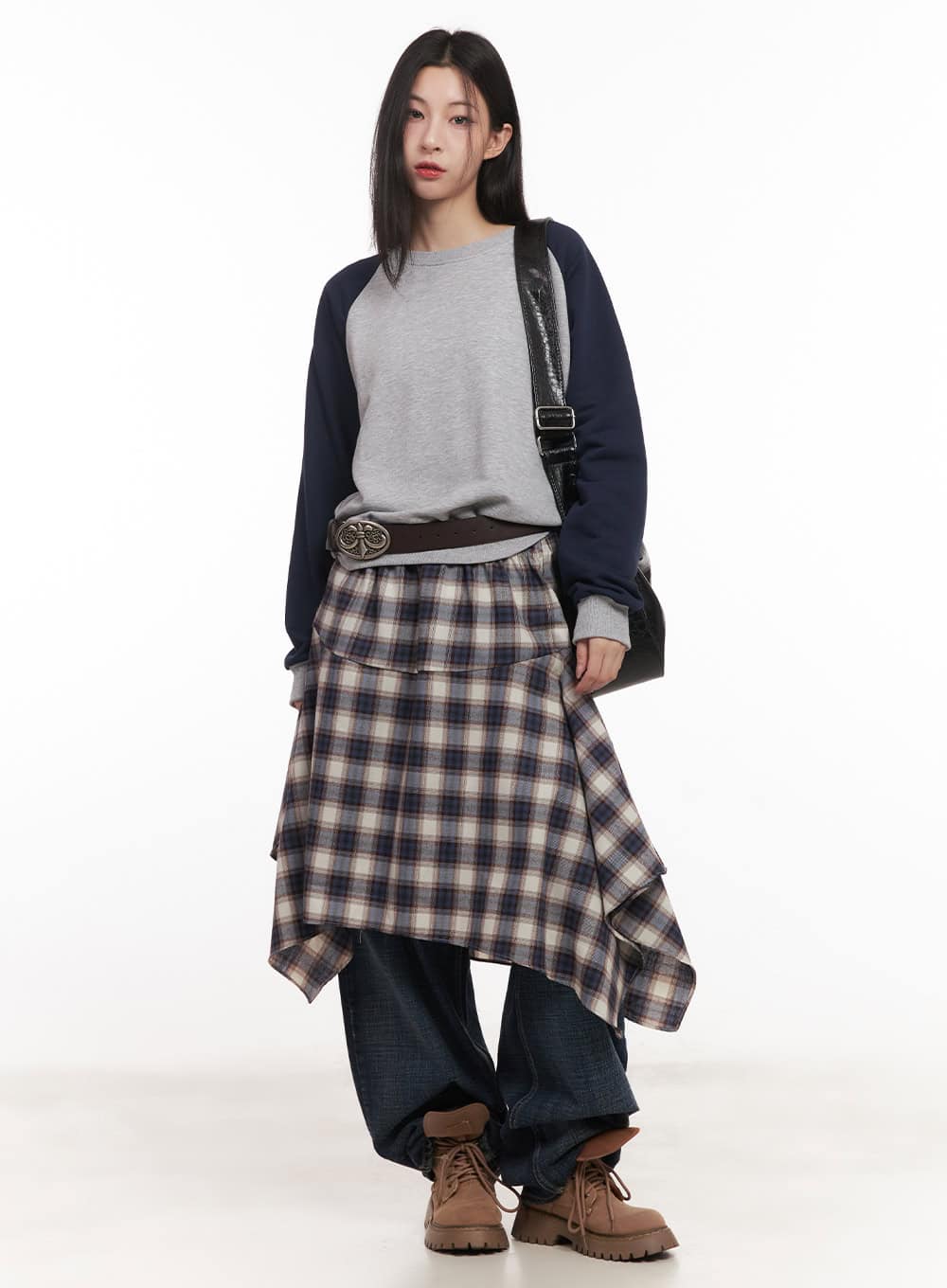 Annie Washed Wide-Leg Jeans CM518 in dark blue, full-body front styling shot on model, layered with plaid wrap skirt, raglan sweatshirt, belt bag, and chunky boots.