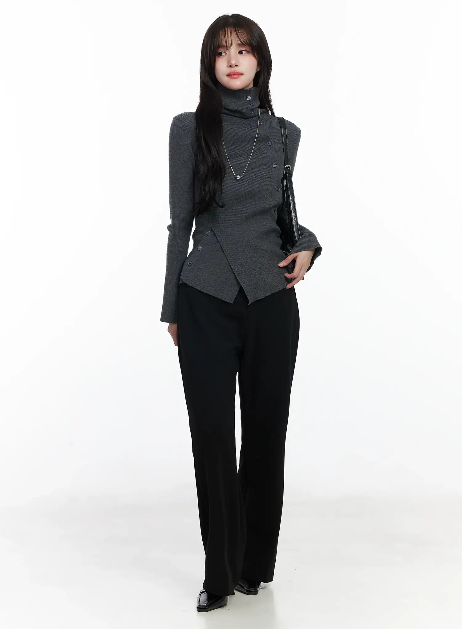 Hip Pad Slacks IJ529 in black, full-length front on model, slim bootcut fit, paired with grey turtleneck top and black shoulder bag, heeled loafers.