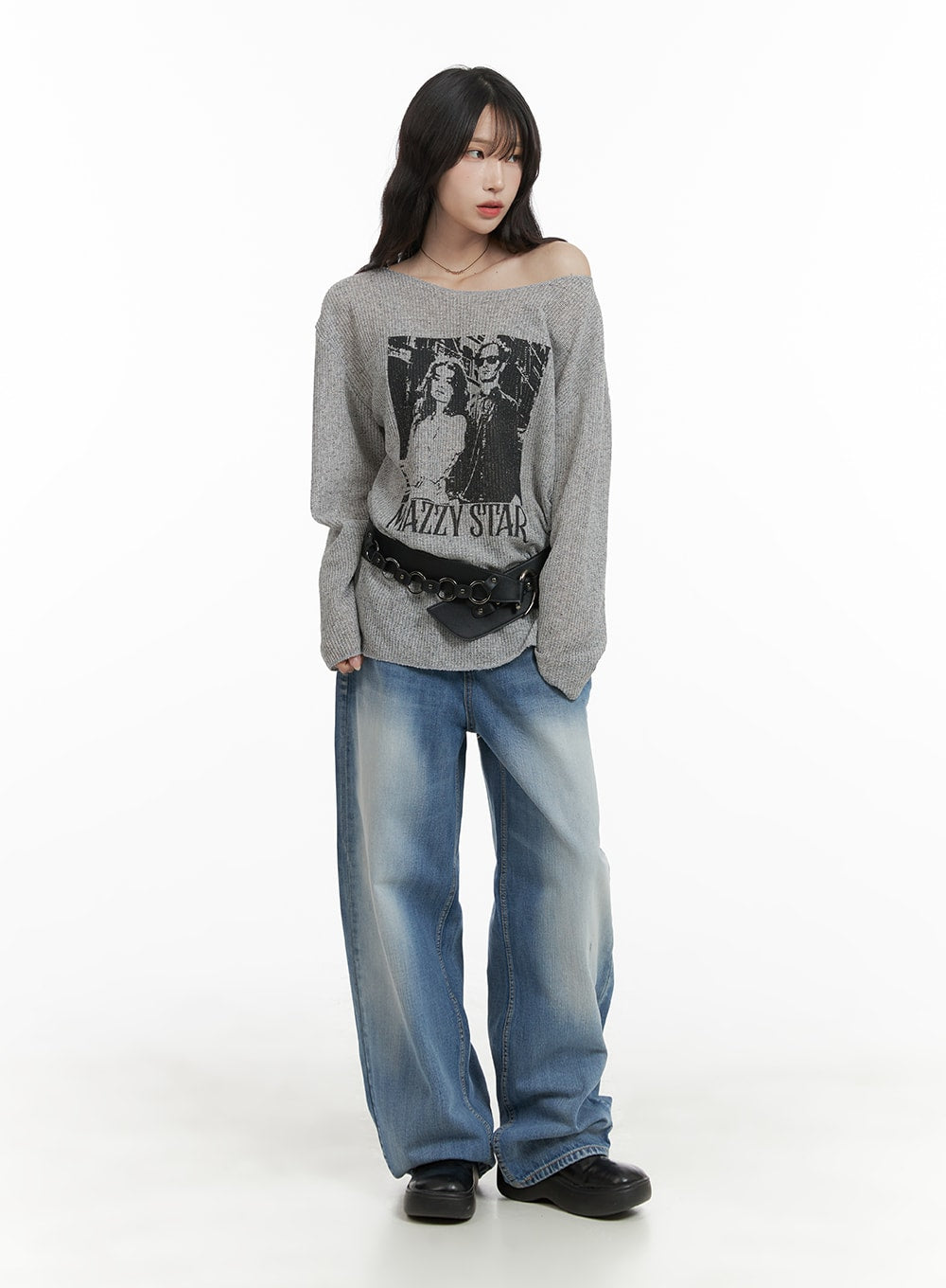 Comfy Wide Fit Baggy Jeans CA408 in blue, full-body front view on female model, wide-leg washed denim pooling at hem, styled with off-shoulder gray graphic sweater and black belt bag.