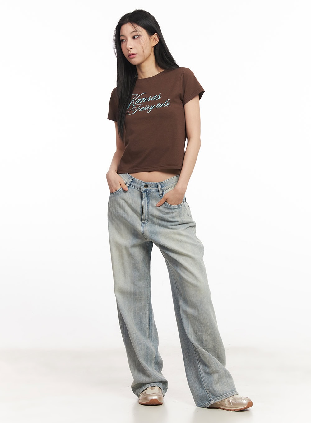Jessi Washed Wide-Leg Jeans CA514 in light blue, full-body front shot on model, relaxed wide-leg denim with vintage wash, styled with brown crop graphic tee and metallic loafers.