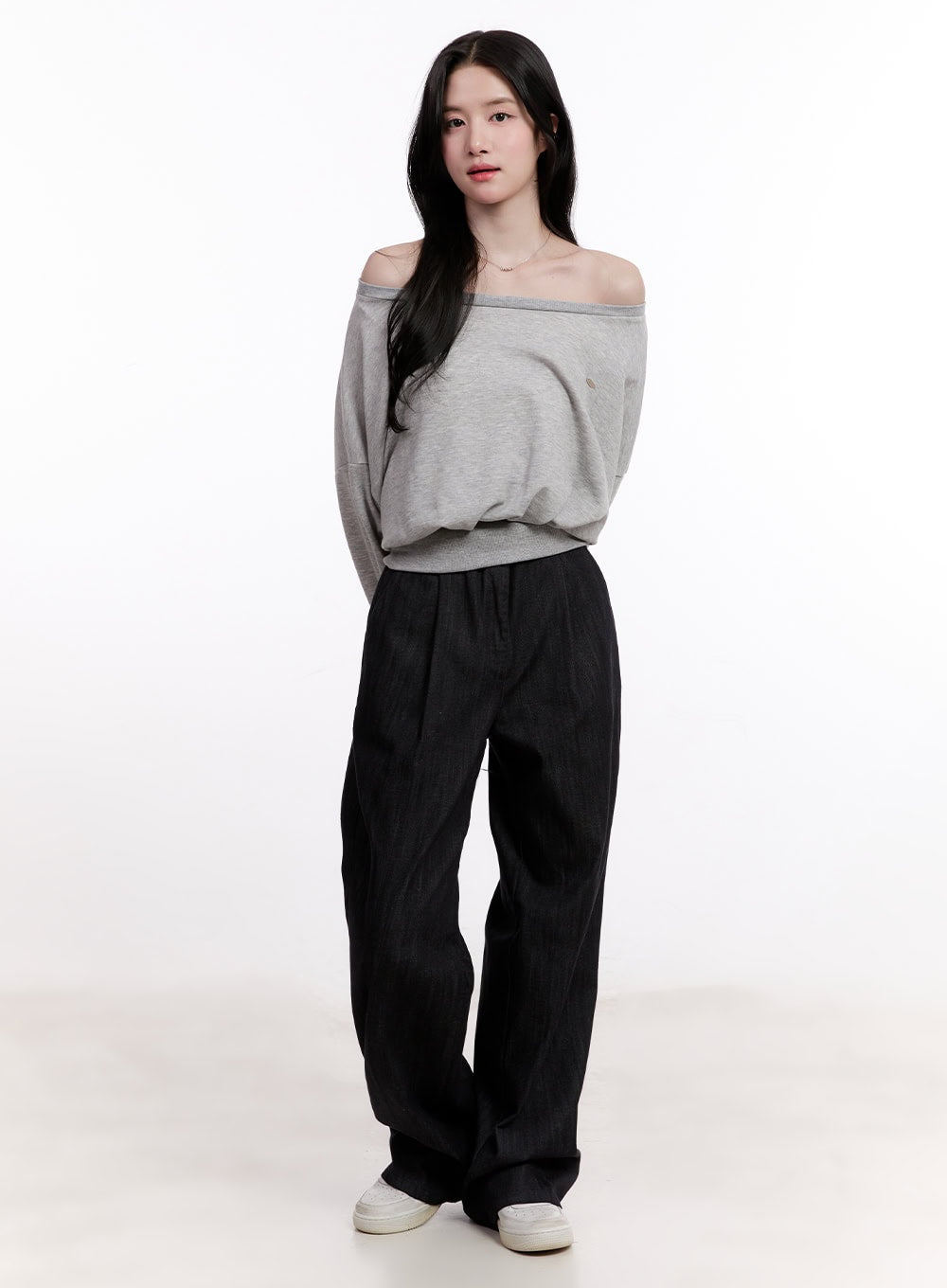 Pintuck Wide-Leg Denim Pants CM527 in black, full-body front on model, wide-fit denim styled with grey off-shoulder top and white sneakers, casual relaxed look.