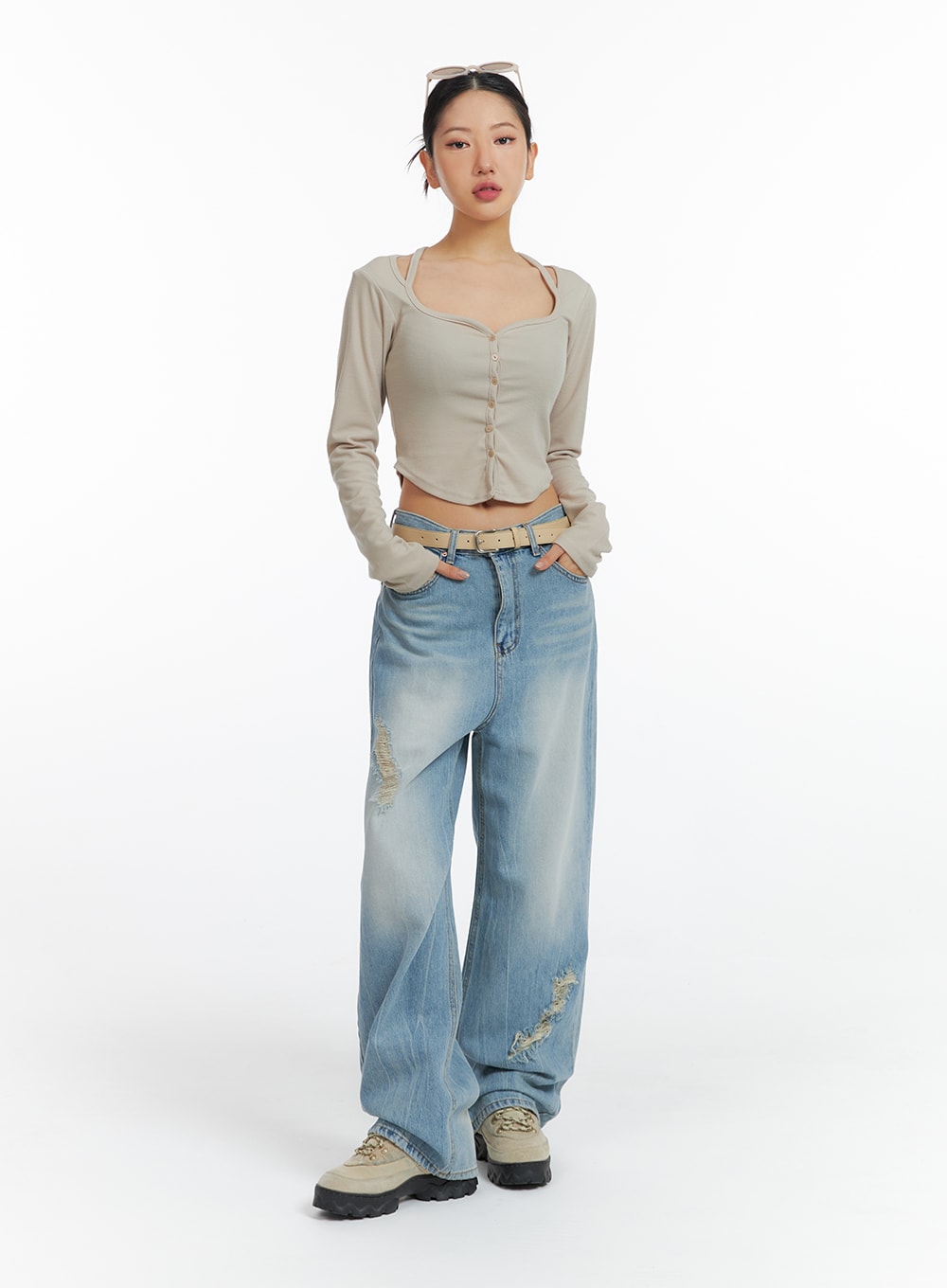 Distressed Wide-leg Jeans CF419 in light blue, full-body front shot on model, wide-fit petite-length washed denim with frayed rips, styled with beige button-up crop top and tan belt.