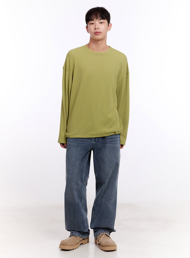 Men's Oversized Waffle-Knit Long Sleeve Tee IM512 in light green, full-body front on model, relaxed oversized fit, waffle-knit, styled with wide-leg jeans and beige chunky shoes.