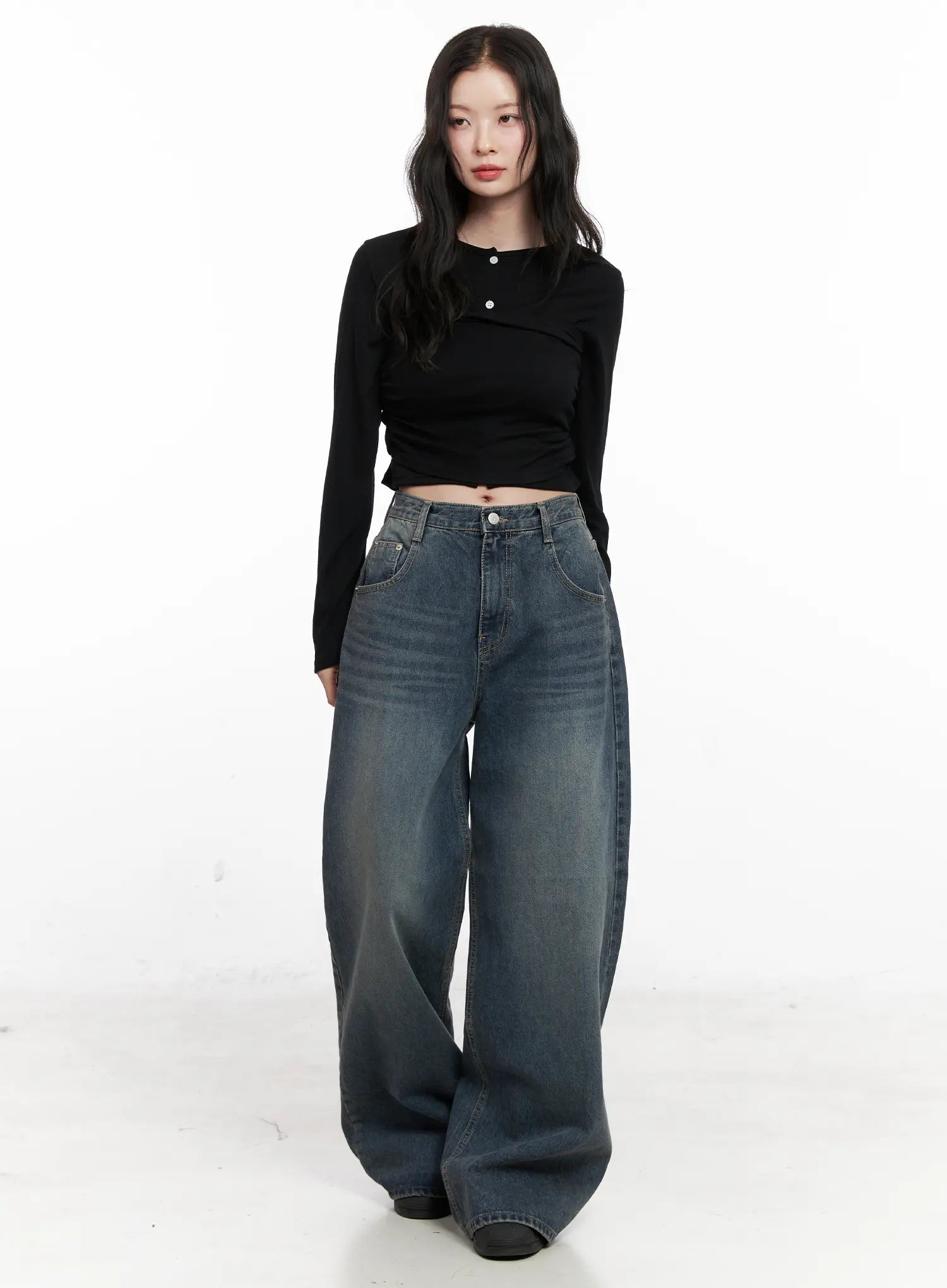 LEWKIN Tutt Washed Wide Leg Jeans CN504 in vintage blue, full front view on model, oversized wide-fit cotton denim with washed fading, paired with black crop top.