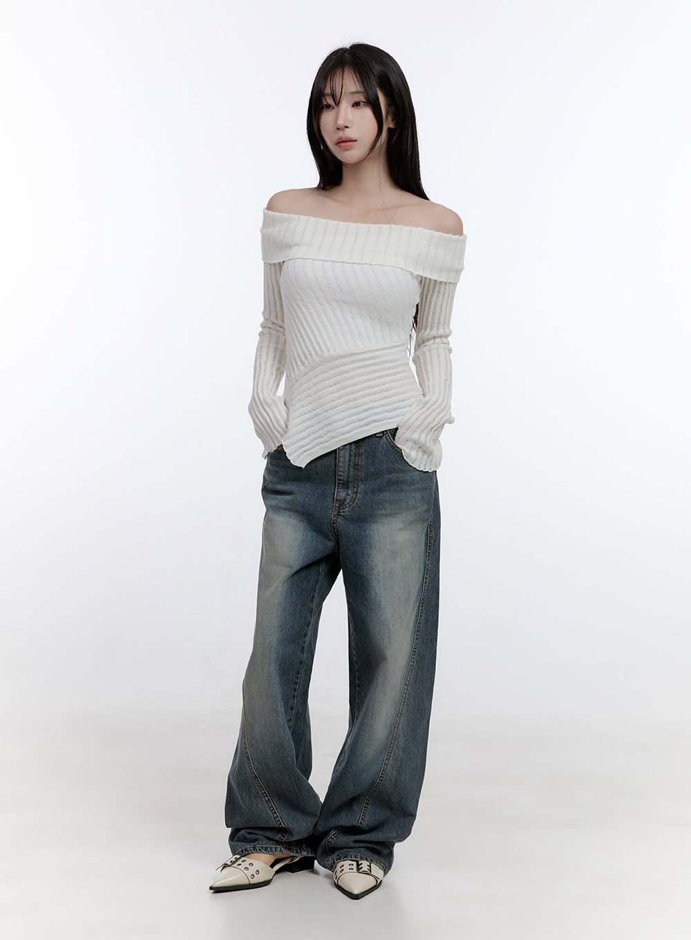 Lucia Stitched Denim Baggy Jeans CO418 in blue, full-body front shot on model, street-style wide fit with vintage wash, styled with cream off-shoulder ribbed knit and silver pointed flats.
