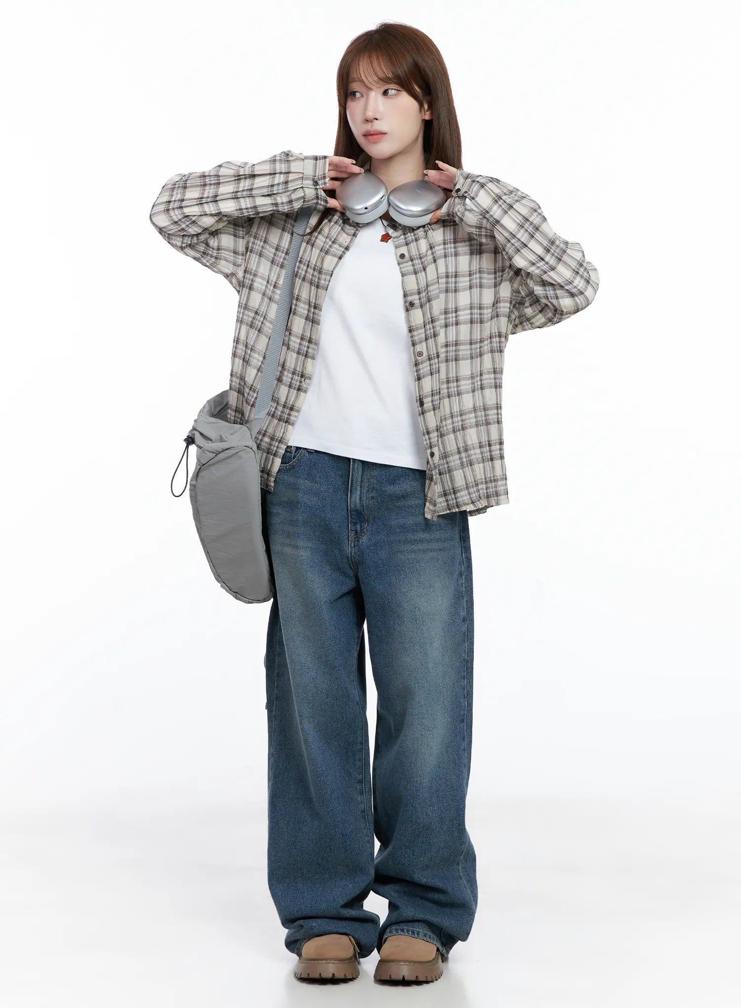 Amalia Wide Leg Vintage Washed Jeans CG529 in blue, full-body front shot on model styled with plaid flannel shirt, white tee, grey bag, and headphones for a casual street look.