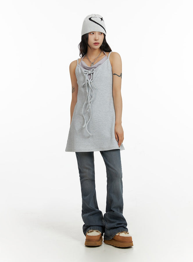 Slim Washed Flared Jeans CF416 in mid-blue, full-body front on model, slim flared leg with washed finish, styled with grey ribbed tank and graphic beanie.