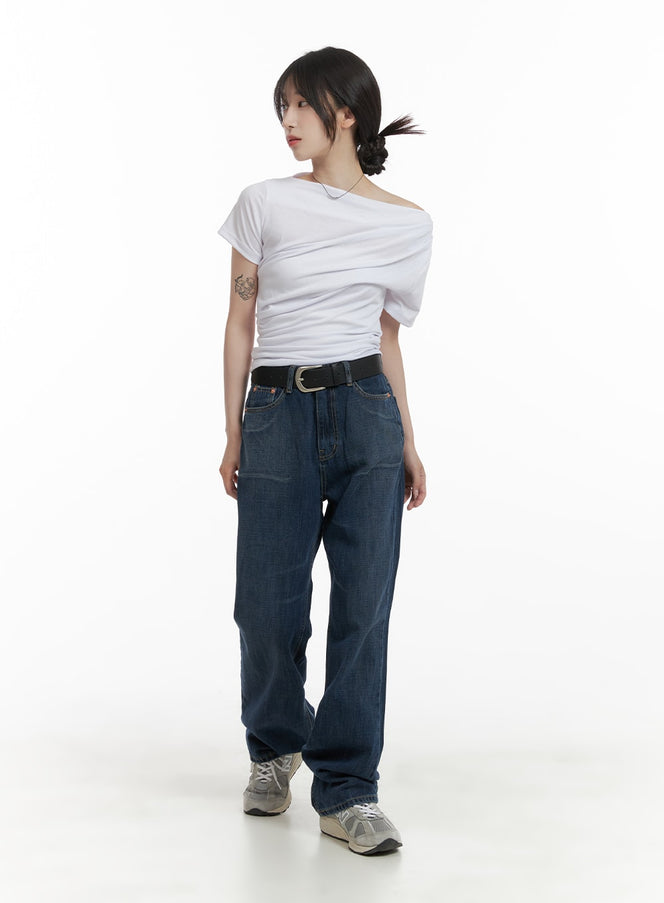 Washed Straight Jeans CA408 in dark blue, full-body front view on model, straight-leg washed denim, belted high waist, paired with white asymmetric top and grey chunky sneakers.