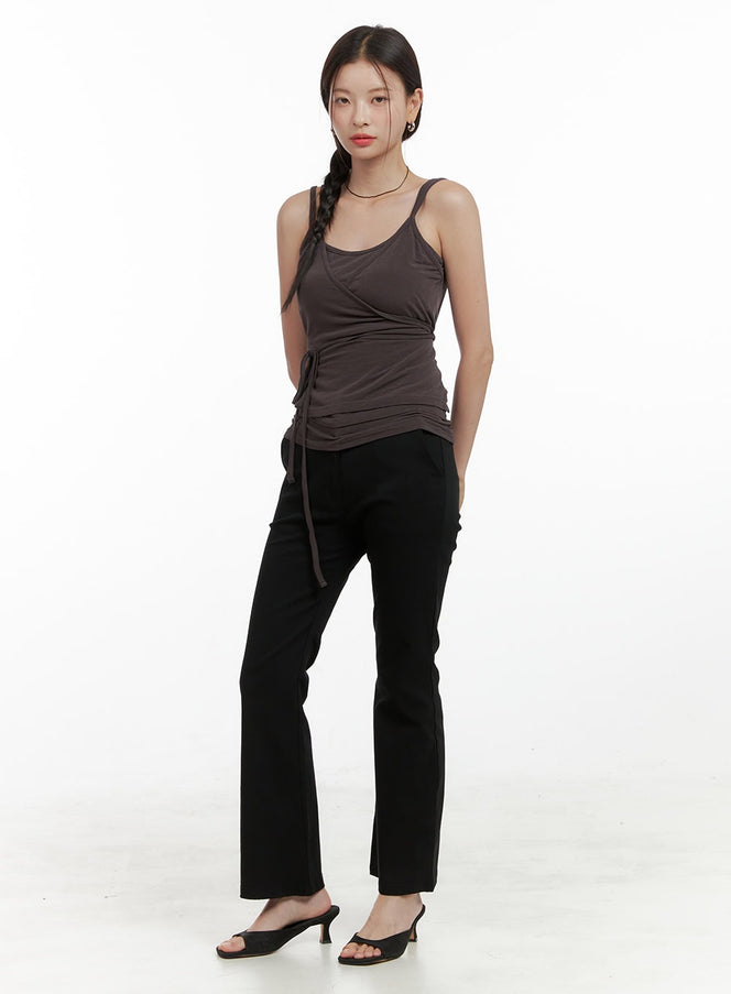 Slim Bootcut Basic Pants OL411 in black, full-body front view on model, slim fit bootcut silhouette, styled with dark brown wrap cami top and black mule heels.