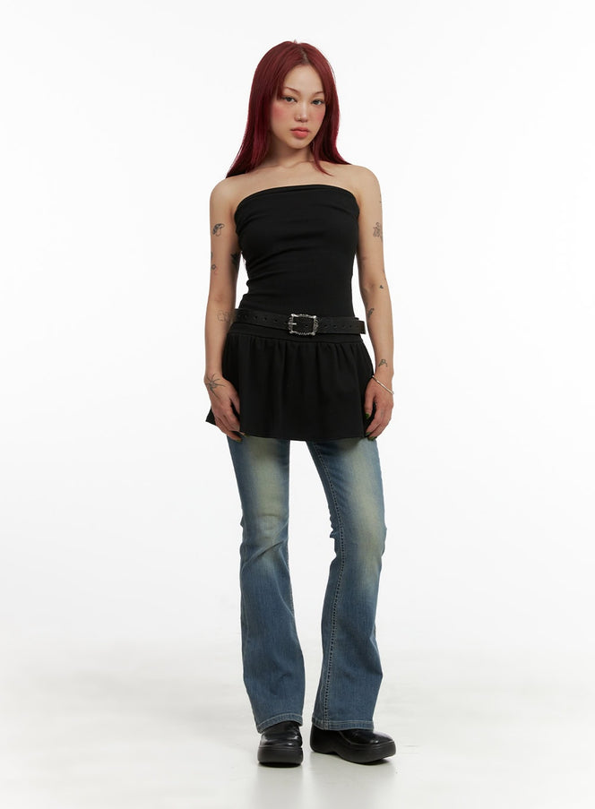 Washed Slim Bootcut Jeans CY429 in blue, full-body front styling shot on model, slim bootcut silhouette paired with black bandeau peplum top and belt.