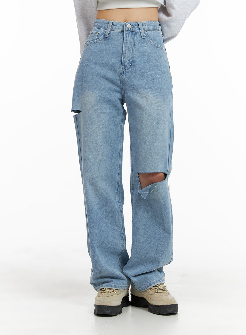 Cut Out Washed Straight Jeans OM421 in blue, front waist-to-hem close-up on model, high-rise straight fit with large thigh cut-out and frayed edge, washed denim texture visible.