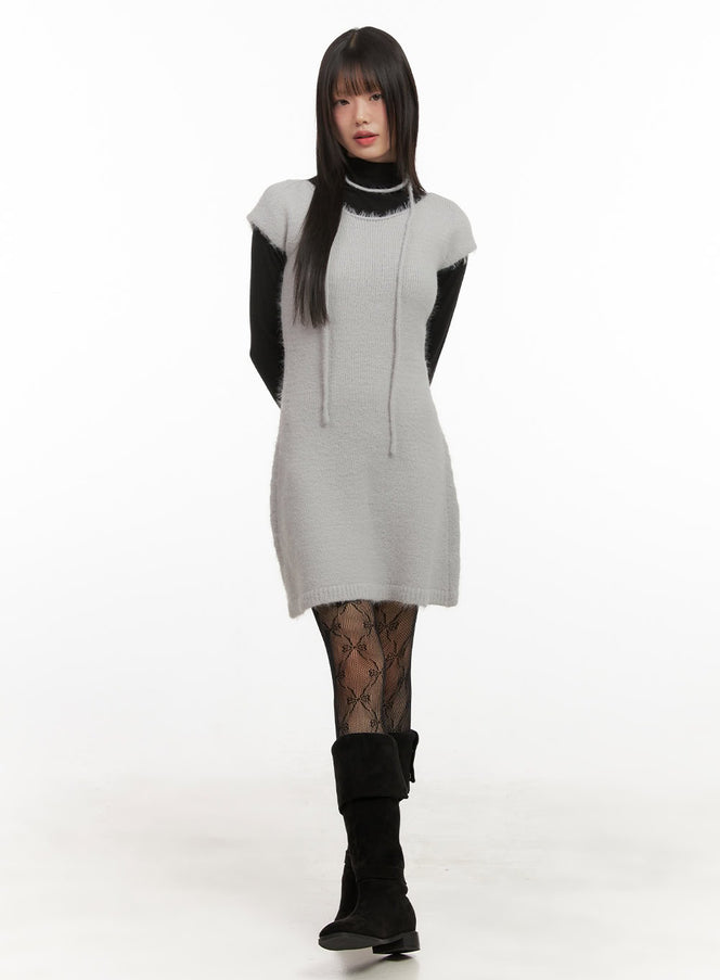 Slim-Fit Wool Blend Mini Dress CJ506 in light grey, full-length front view on model, soft fuzzy knit, layered over black turtleneck long sleeve, with lace tights and black knee boots.