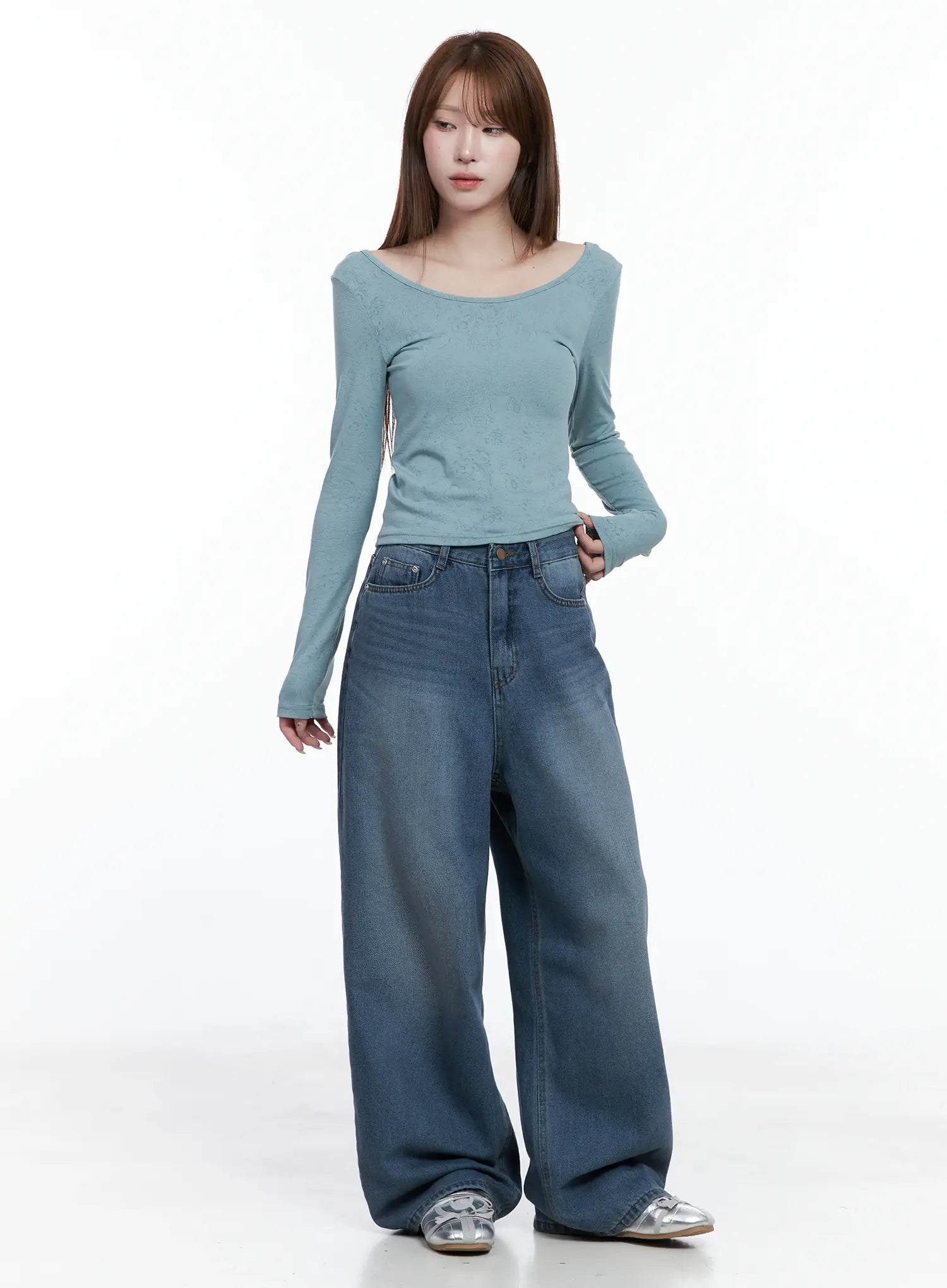 Margot Low-Rise Washed Wide-Leg Jeans CS501 in dark blue, full-body front on model, extra-wide leg silhouette, styled with teal long-sleeve top and silver sandals.
