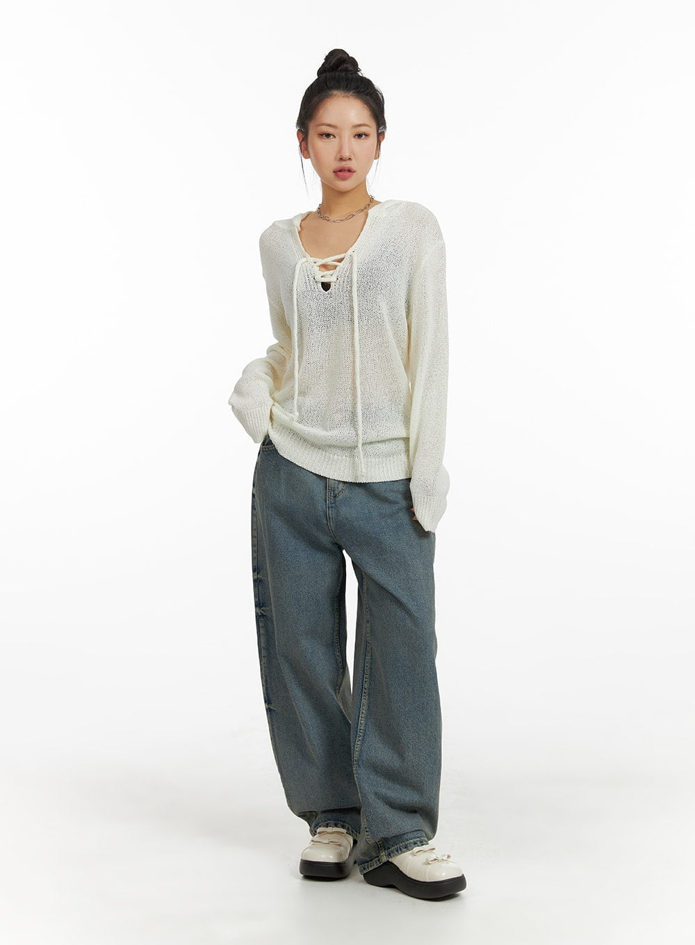 Urban Chic Washed Baggy Jeans CM411 in blue, full-body front shot on model, wide-fit washed denim with roomy silhouette, styled with ivory lace-up knit top and platform clogs.