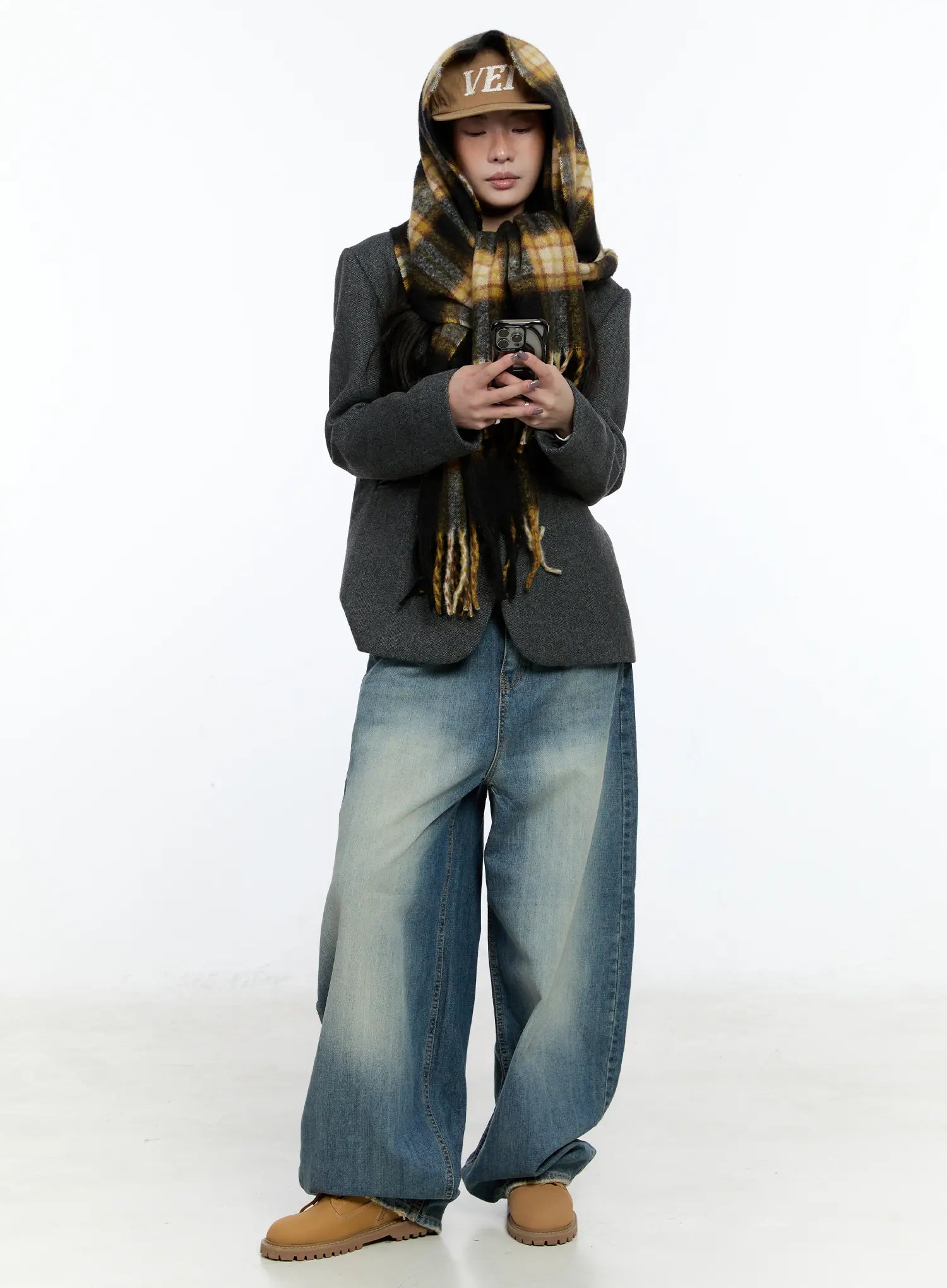 Jiso Baggy Wide Jeans CN517 in blue, full-body editorial shot on male model, washed wide leg pooling at hem, paired with grey blazer, plaid scarf, and tan boots.