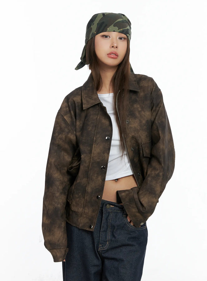 Oversized Print Leather Jacket CS505 in dark brown, front close-up on model, snap-button closure with zipper, collar neckline, cloud-dye gradation faux leather, paired with white crop top.