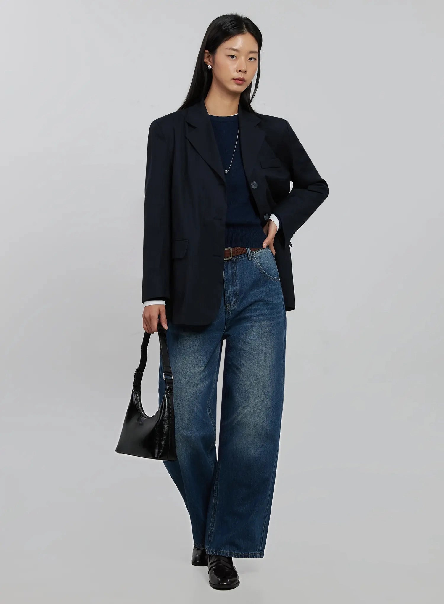 Alaina Wide Leg Jeans IJ508 in dark blue, full-length 3/4 angle on model styled with navy blazer, navy knit, brown belt, and black leather bag.