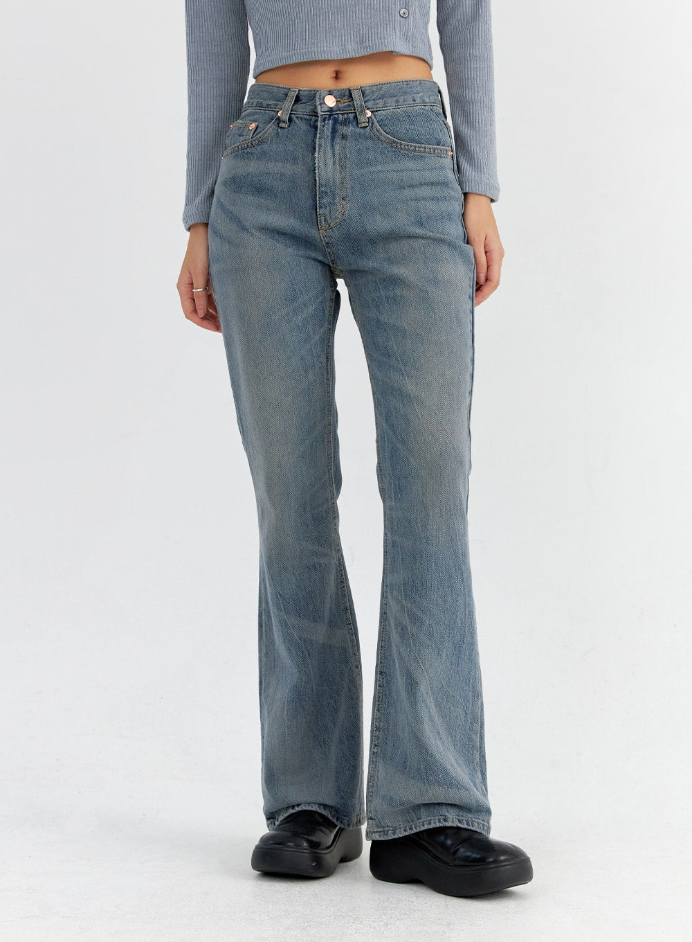 Vintage Washed Bootcut Jeans CO325 in blue, front mid-body close-up on model, slim fit high-rise waist with five-pocket design and subtle vintage wash, bootcut silhouette visible.