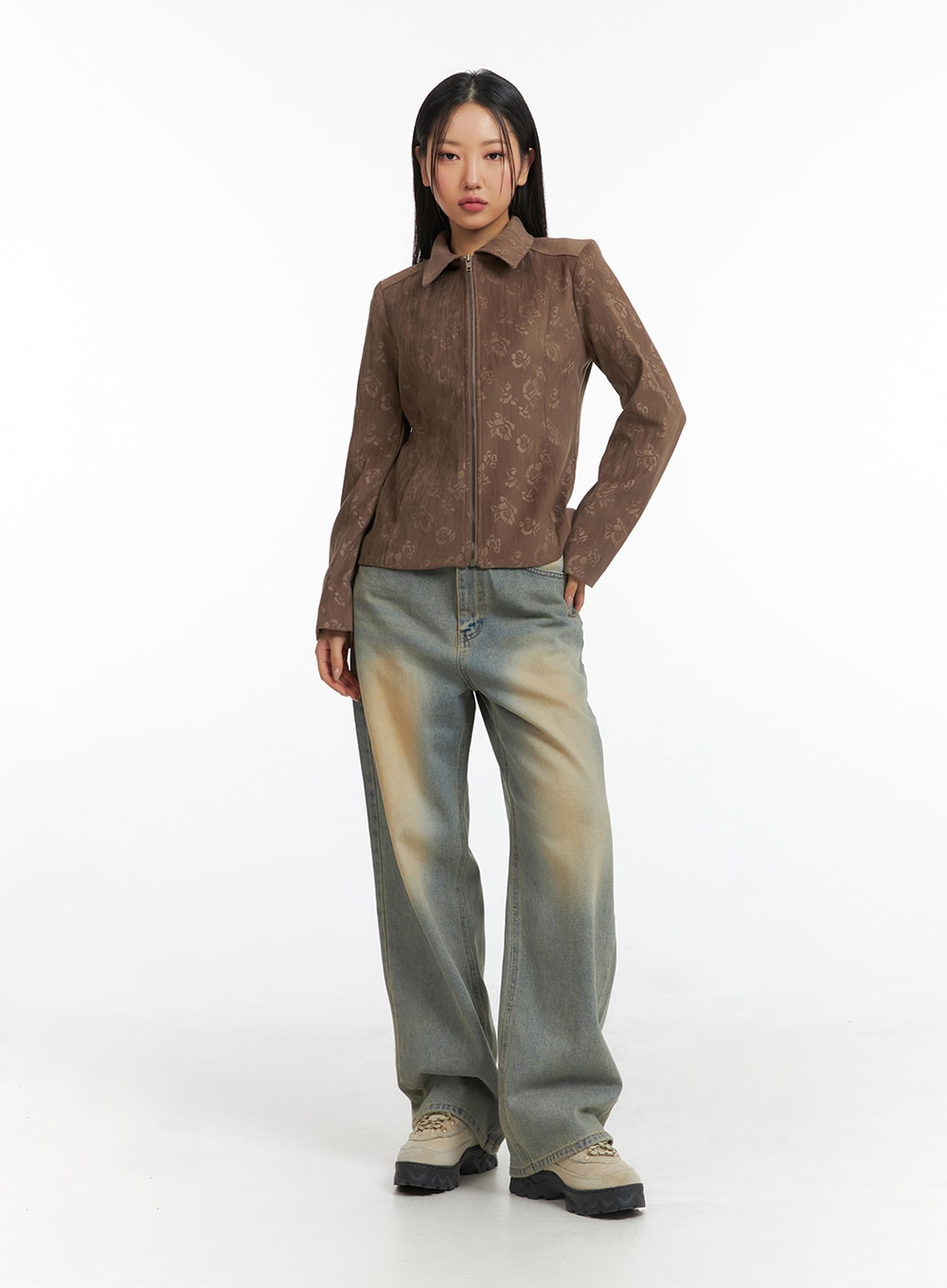 Dark Wash Jeans CF303 in blue, full-body front shot on model, wide-leg washed denim with earthy fade, styled with brown floral zip jacket and chunky boots.