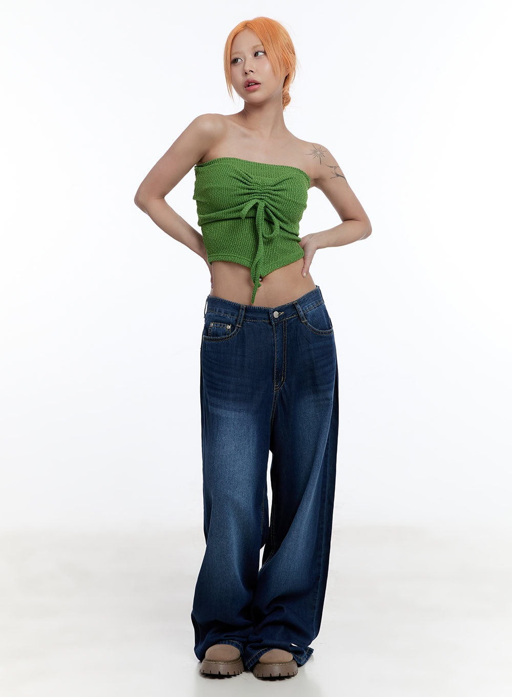 Jill Baggy Jeans CY530 in dark blue, full-body front view on model, ultra-wide washed denim silhouette styled with green ruched bandeau top and beige chunky sandals.