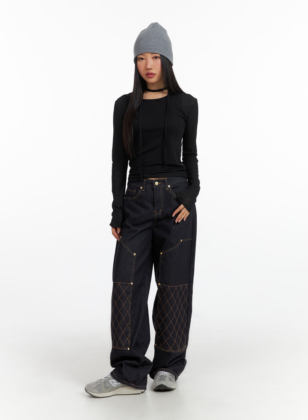 Stitched Wide Denim Jeans CF408 in dark navy, full-body front view on model, tall wide-leg silhouette with gold stud accents and diamond stitch panels, styled with black long-sleeve and grey beanie.