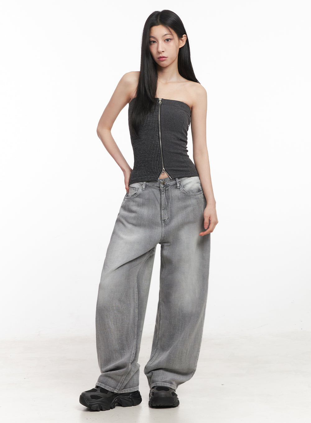 Flore Washed Wide-Leg Jeans IY516 in gray, full-body front shot on model, oversized wide-leg silhouette, styled with dark ribbed zip tube top and chunky sneakers.