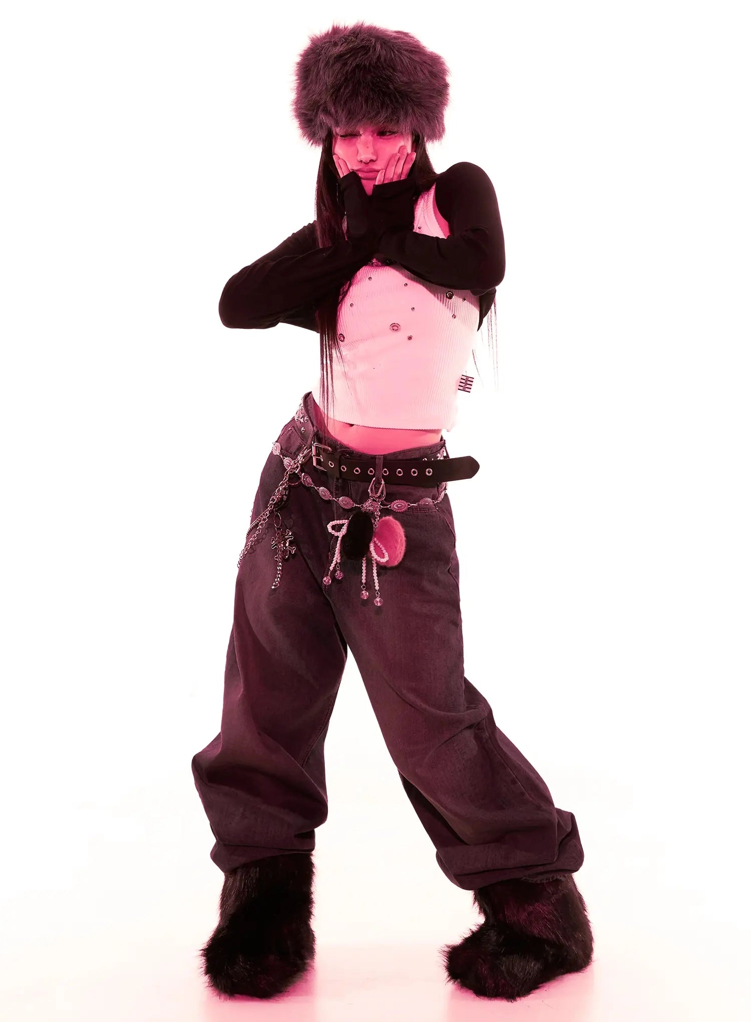 Elora Washed Baggy Jeans IS525 in dark blue, full-body editorial shot, model in wide stance wearing chain belt and fur accessories, street acubi styling under pink lighting.