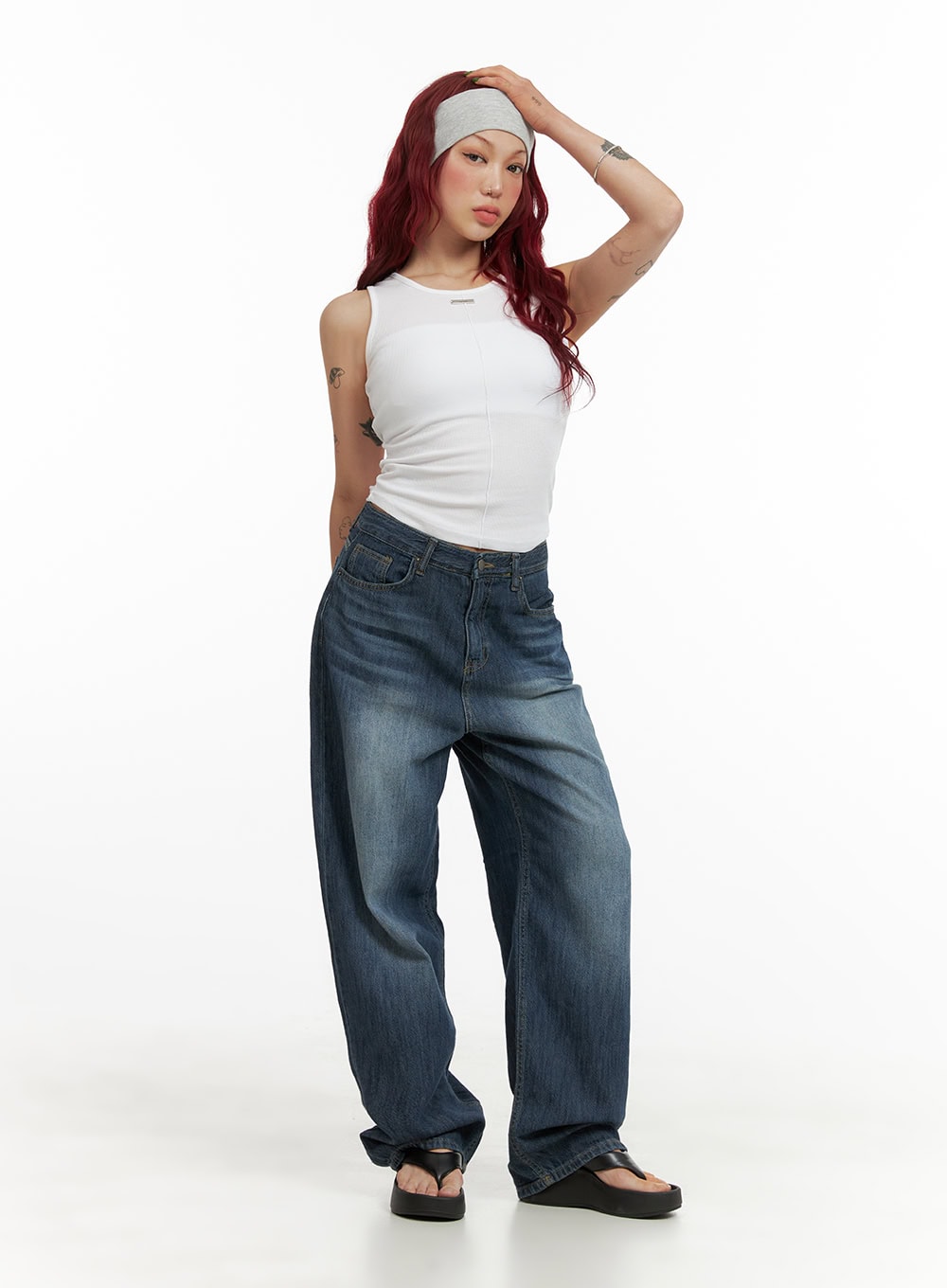 Wide Fit Baggy Jeans CY430 in dark blue, full-body front shot on model, oversized washed denim with roomy thighs pooling at hem, styled with white tank and gray headband.