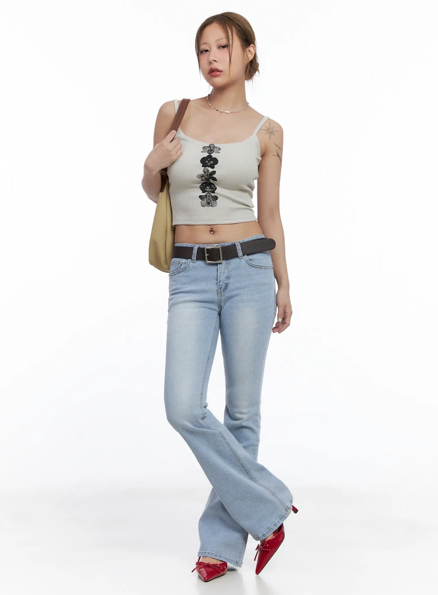 Yeojin Classic Flare Denim Jeans CL510 in light blue, full-body front shot on model, casual flare fit with belt, styled with beige crop cami top, tote bag, and red mules.